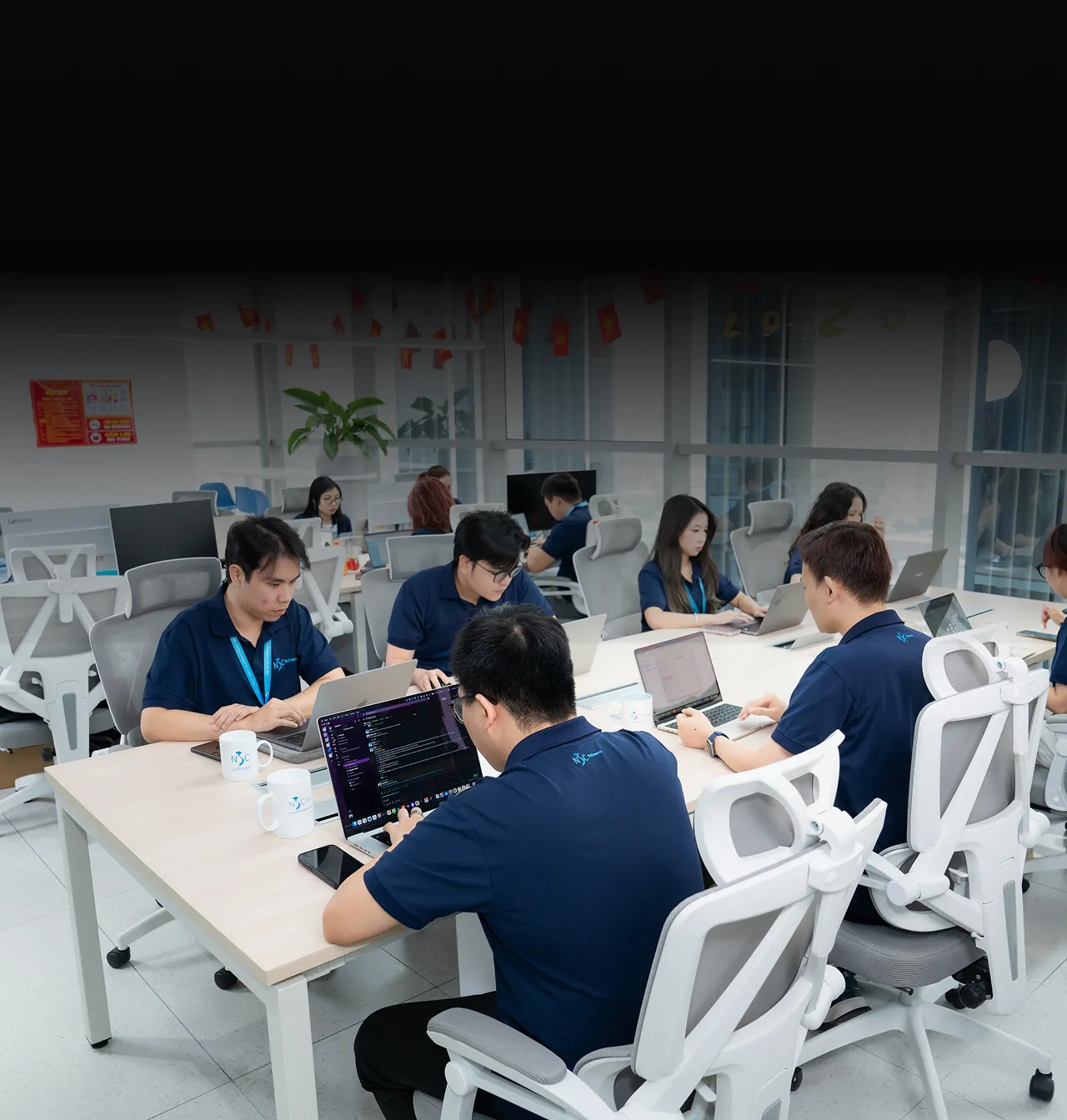 NSC senior engineers collaborating in a modern office