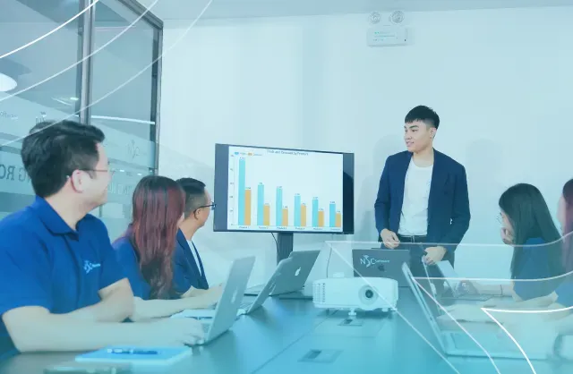 NSC Software team collaborating in a modern office