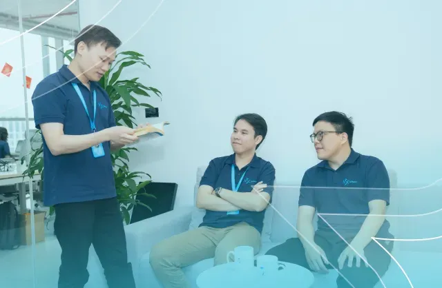 NSC Software team collaborating in a modern office