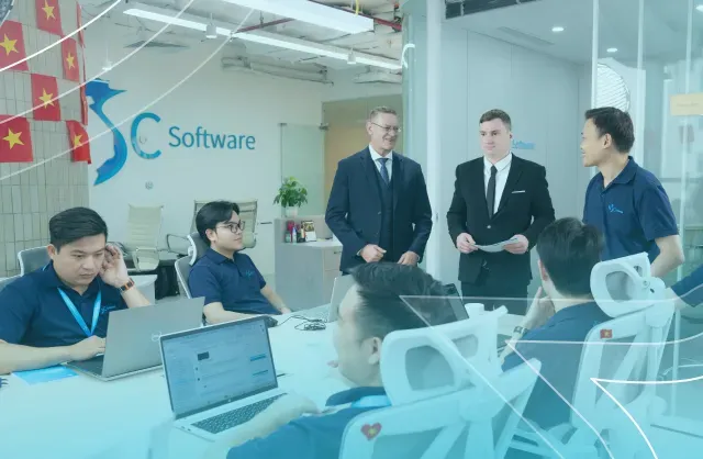 NSC Software team collaborating in a modern office