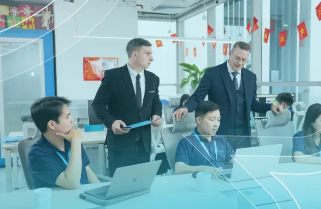 NSC Software team collaborating in a modern office